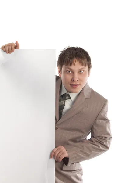 Podnikatel drží prázdnou bílou tabuli — Stock fotografie