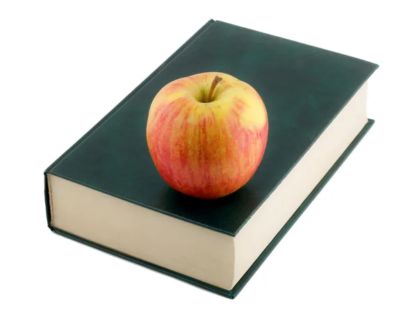 Apfel im Buch — Stockfoto