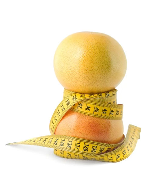 Grapefruit and measuring tape — Stock Photo, Image