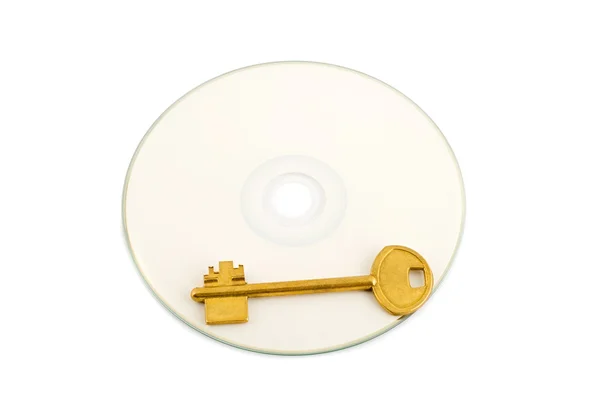 Chiave dorata su compact disk — Foto Stock
