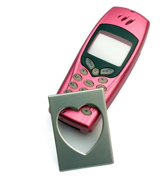 Telefono rosa con foto per fotogramma alla maniera del cuore — Foto Stock