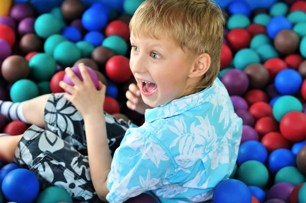 Boy playing with balls — Stock Photo, Image