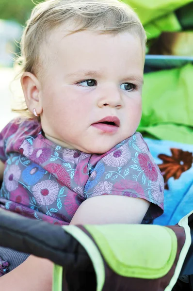 Baby girl in stroller — Stock Photo, Image