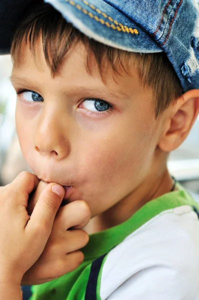 Little boy licking his finger — Stock Photo, Image