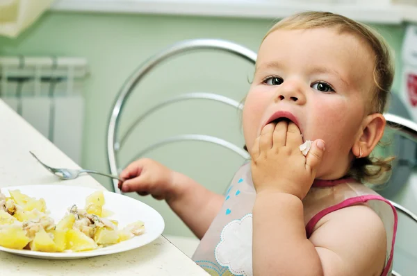 Stock image She likes to eat