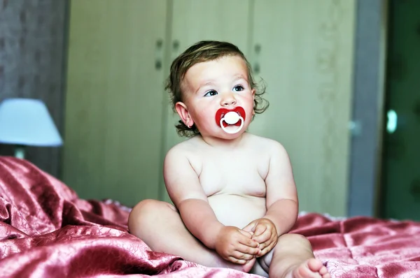 Baby with soother — Stock Photo, Image