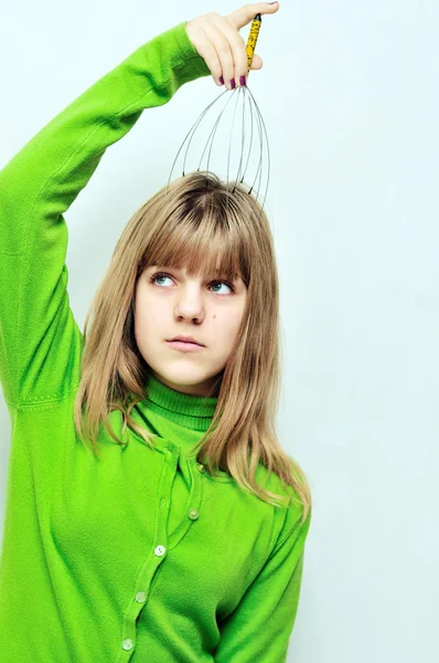 Girl using scalp massager — Stock Photo, Image