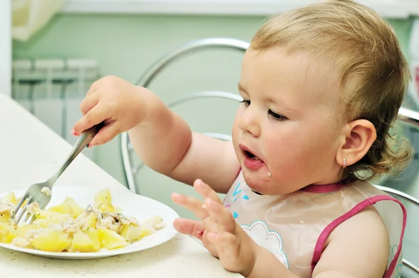 Baby with fork — Stock Photo, Image
