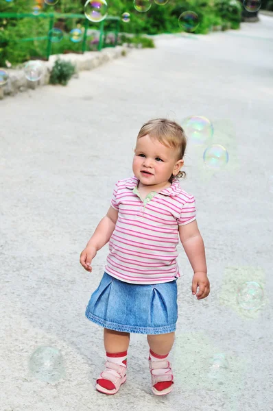 Baby girl and bubbles — Stock Photo, Image