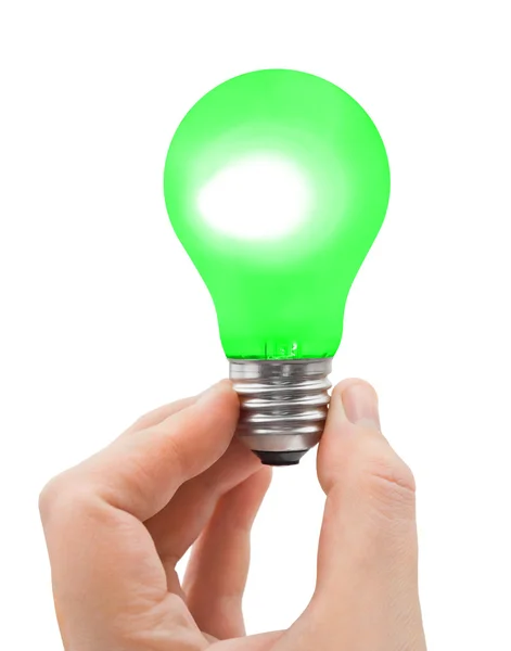 Рука с зеленой лампочкой — стоковое фото