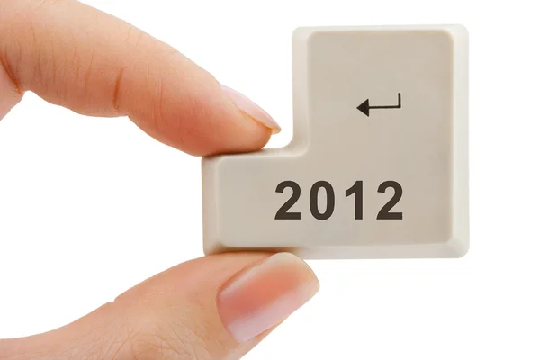 Computer button 2012 in hand — Stock Photo, Image