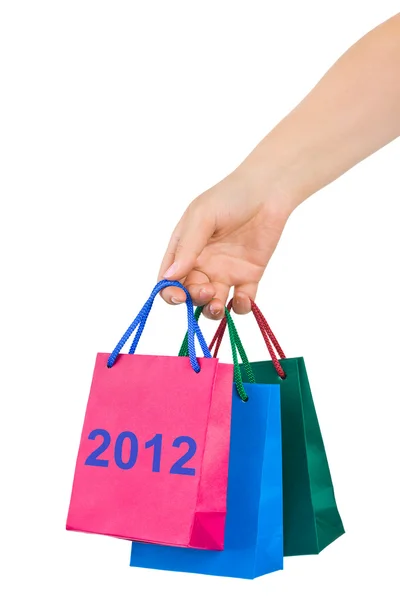 Hand with shopping bags 2012 — Stock Photo, Image