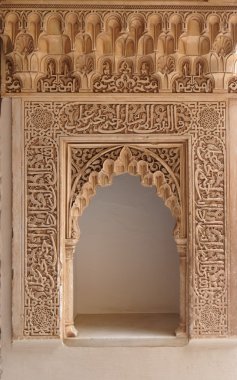 Carved door in the Alhambra palace in Granada, Spain clipart