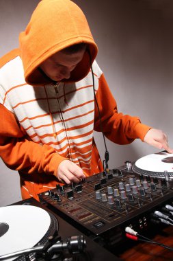 DJ playing music on vinyl turntables clipart