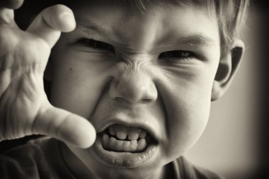 A little boy in anger clipart
