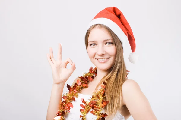 Attractive young women in santa claus hat — Stock Photo, Image