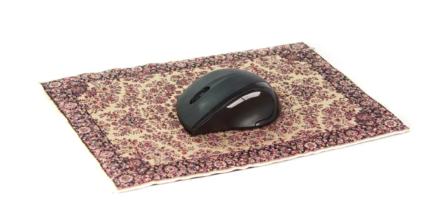 Компьютерная мышь на ковре — стоковое фото