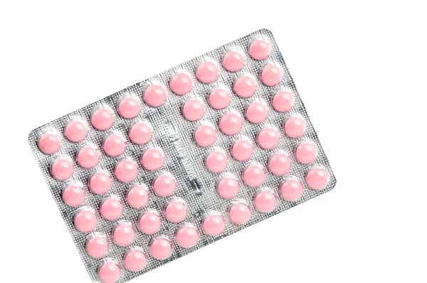Пачка розовых таблеток — стоковое фото