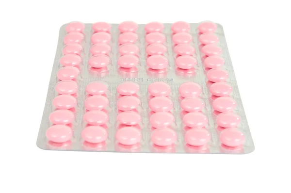 Förpackning med rosa tabletter — Stockfoto