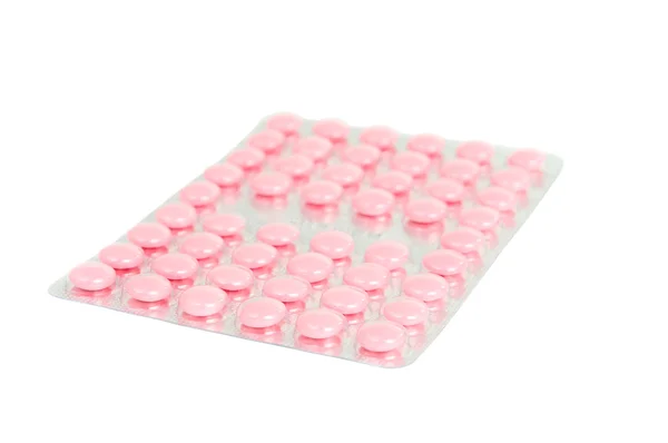 Embalagem de comprimidos cor de rosa — Fotografia de Stock