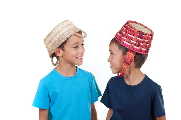 stock image Twins playing with wicker baskets