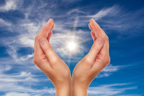Hands over blue sky — Stock Photo, Image