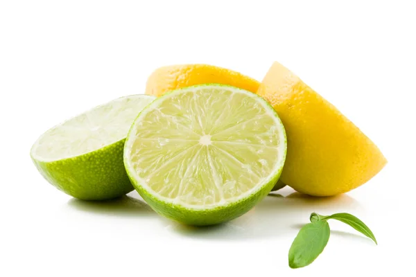 Lemons and Limes with leaves — Stock Photo, Image