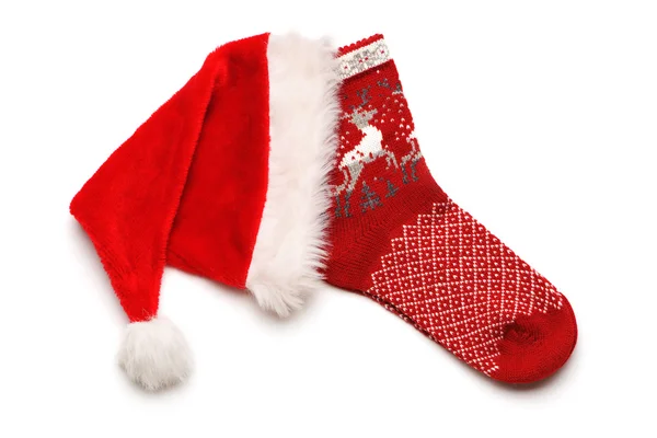 Noel çorap ve santa şapka — Stok fotoğraf