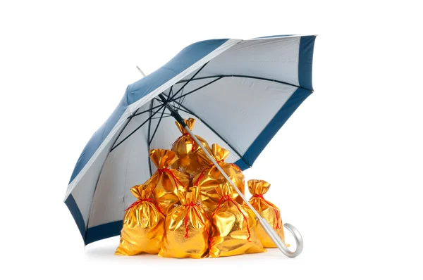 stock image Golden sacks under protection of umbrella