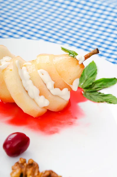 Pear with wine sauce in plate — Stock Photo, Image