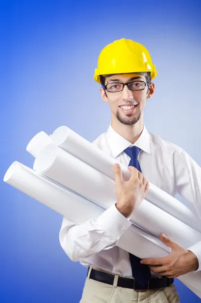 Young engineer working with drawings — Stock Photo, Image