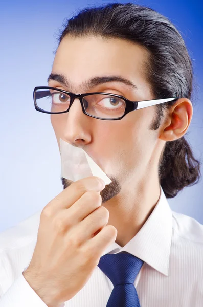 Бизнесмен с запечатанными губами — стоковое фото