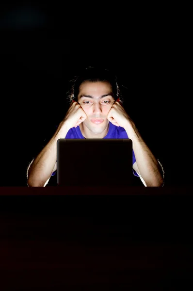 Hacker sitting in dark room — Stock Photo, Image