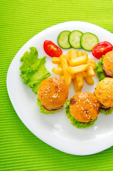 stock image Plate with tasty mini burgers