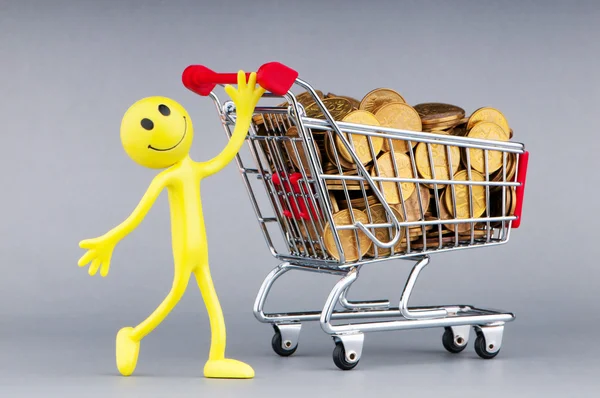 Smajlíci s nákupní vozíky a mince — Stock fotografie