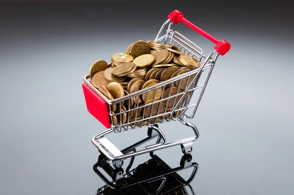 Shopping cart and gold coins — Stock Photo, Image