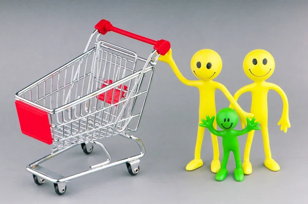 Shopping cart and happy smilies Stock Photo