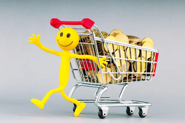 Smilies with shopping carts and coins — Stock Photo, Image