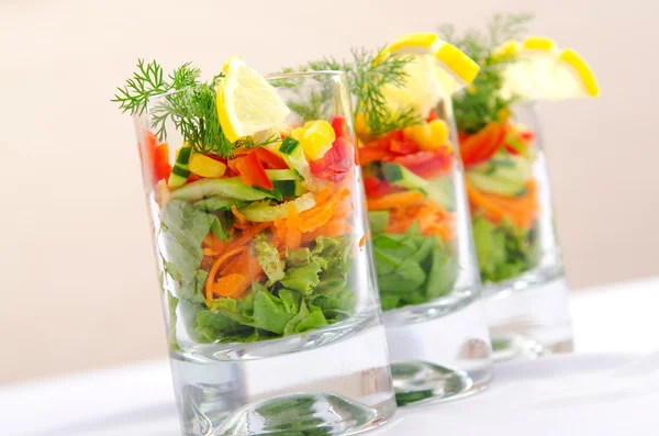 Delicious salad in the glasses — Stock Photo, Image