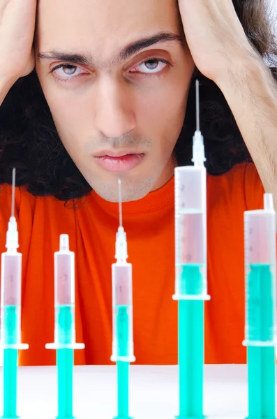 Young druc addict with syringe — Stock Photo, Image