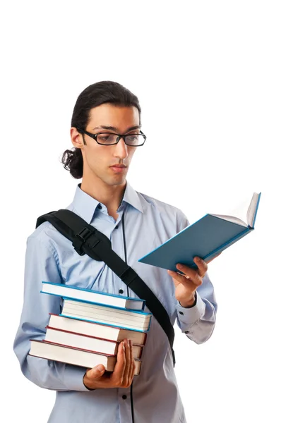 Студент зі стопкою книг на білому — стокове фото