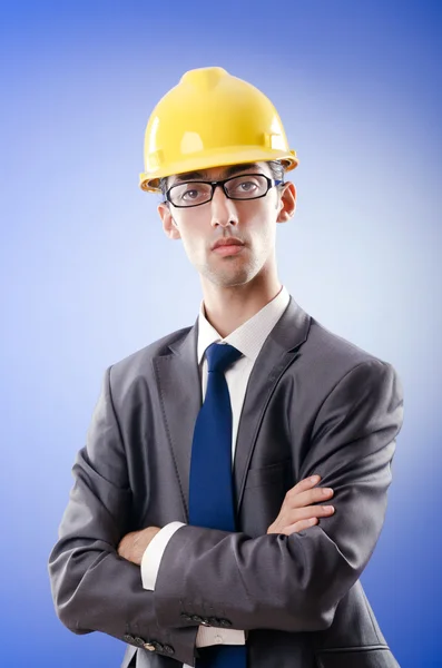 Young architect with drawings and hardhat Royalty Free Stock Images