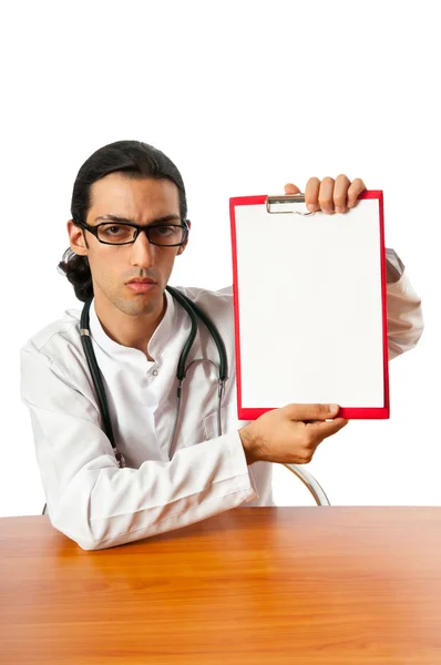 Doctor sitting at the desk on white — Stock Photo, Image