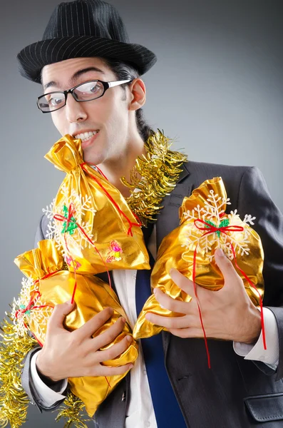 Businessman with sacks of presents — Stock Photo, Image