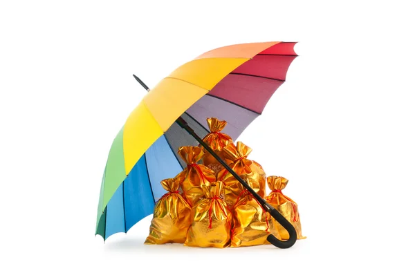 stock image Golden sacks under protection of umbrella