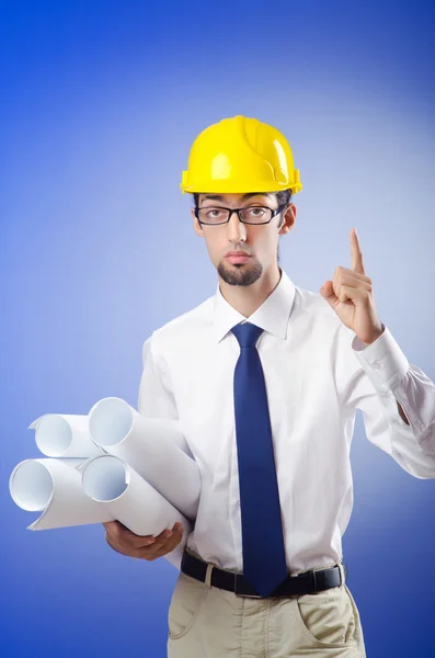 Young engineer working with drawings — Stock Photo, Image