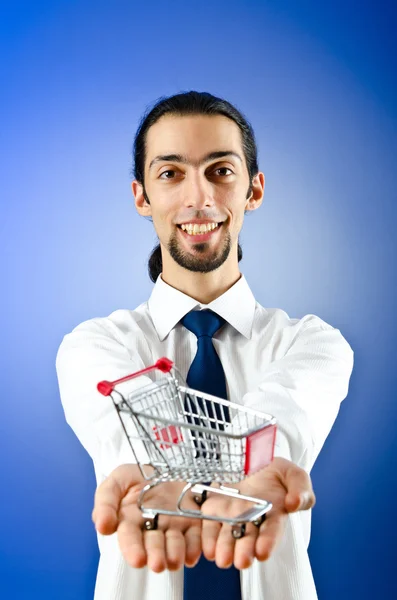 Business concept - Hands holding shopping cart — Stock Photo, Image