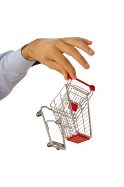 Hand holding shopping cart on white