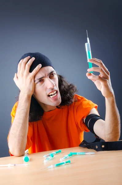 Young druc addict with syringe — Stock Photo, Image