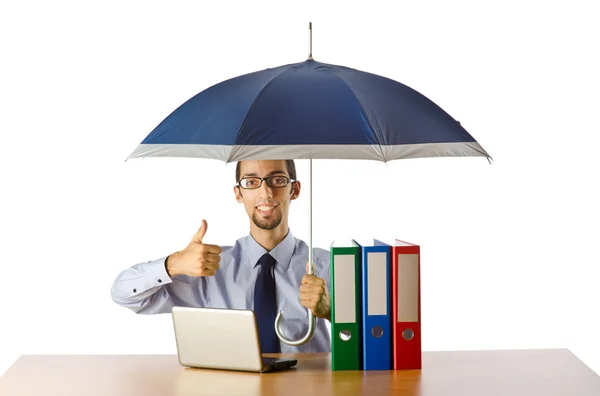 Empresário segurando guarda-chuva no escritório — Fotografia de Stock